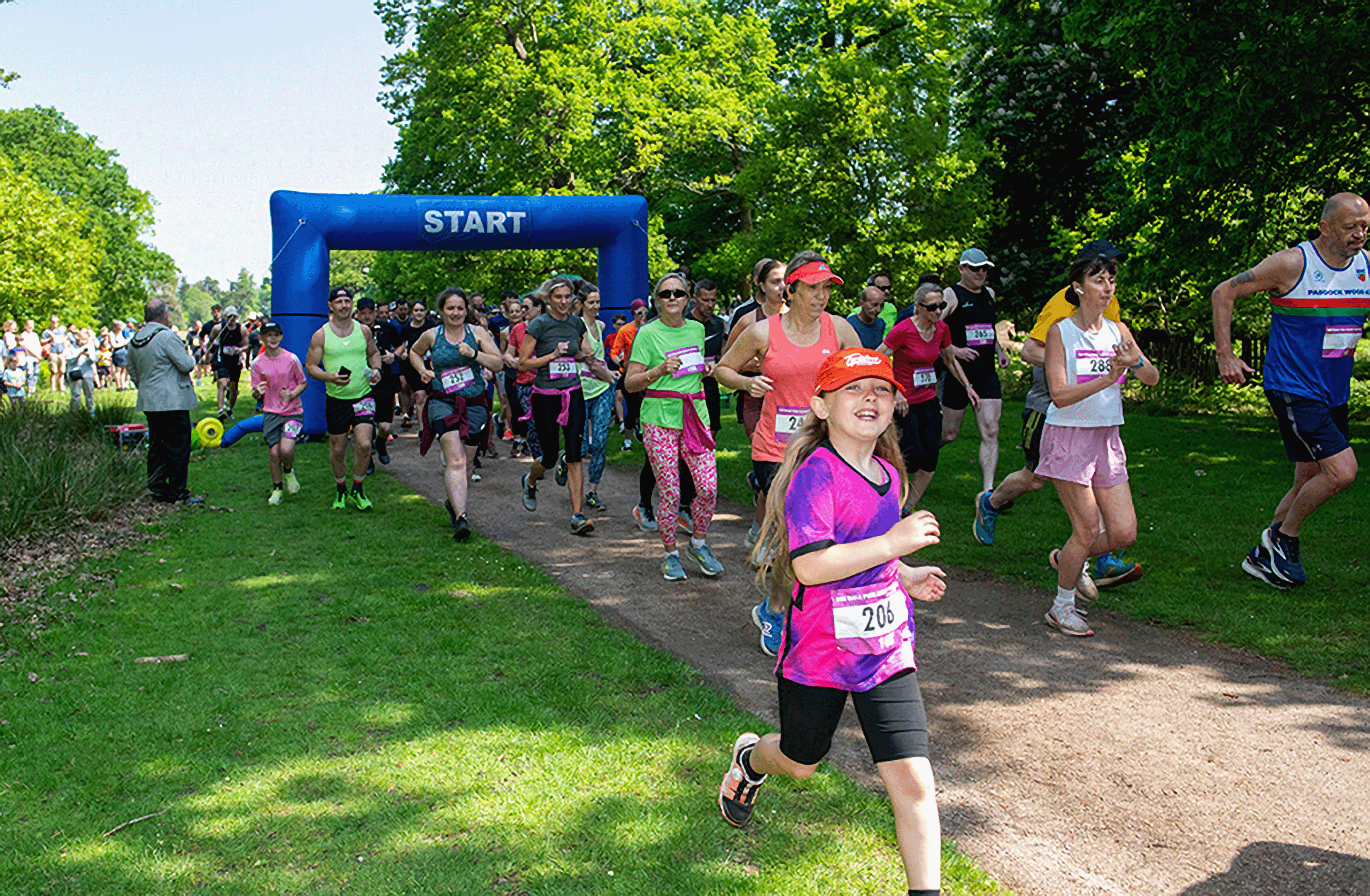 People running with a start line in the background